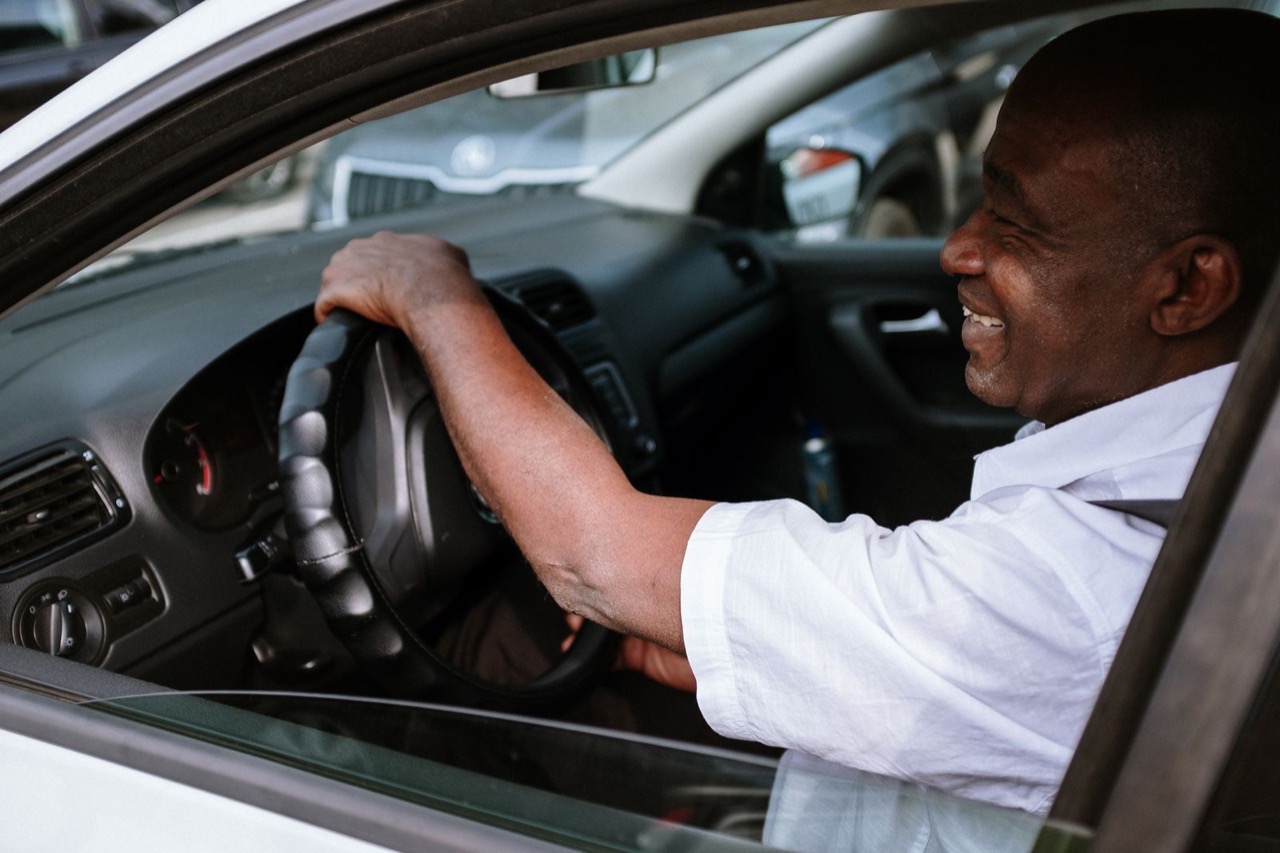 A driver smiling behind the wheel